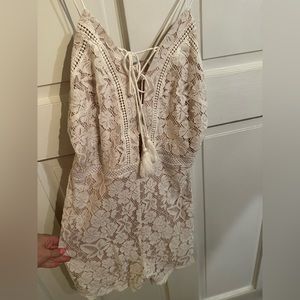 White lace romper, perfect for a bride or summer outfit.